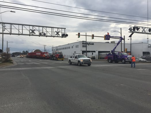 Oversize load being escorted by Kenco Bucket Trucks.