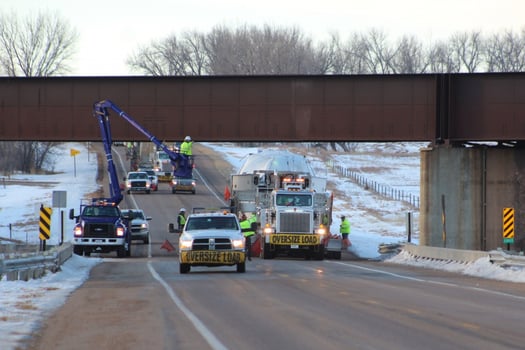Removing aerial obstacles for "snag free" oversize load transport.