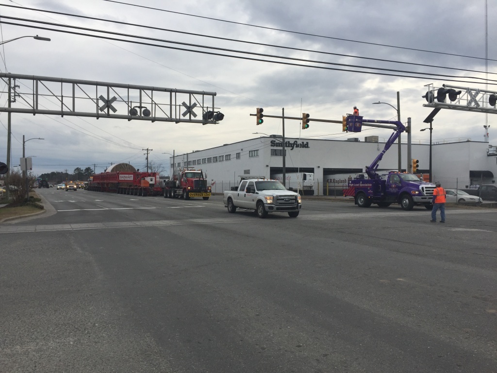 Oversize load being escorted by Kenco Bucket Trucks.